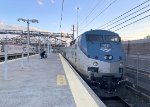P42DC # 119 pushes Amtrak Train # 119 out of the station into the yard